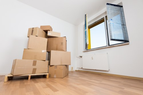 Packed moving boxes and furniture ready for removals in Brompton