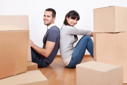 Professional movers loading furniture for a Brompton relocation
